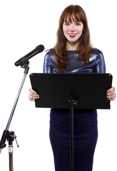 Girl speaking into a microphone — Stock Photo, Image