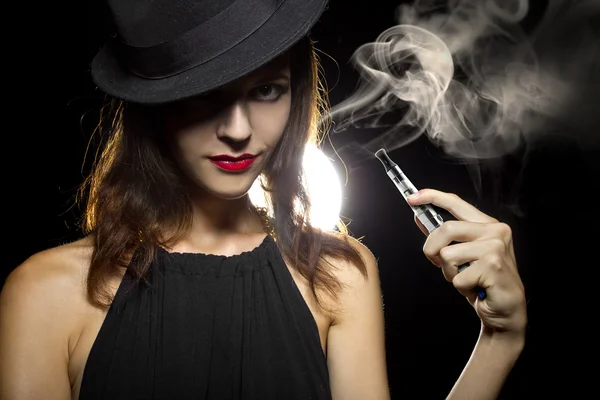 Woman vaping an electronic cigarette — Stock Photo, Image