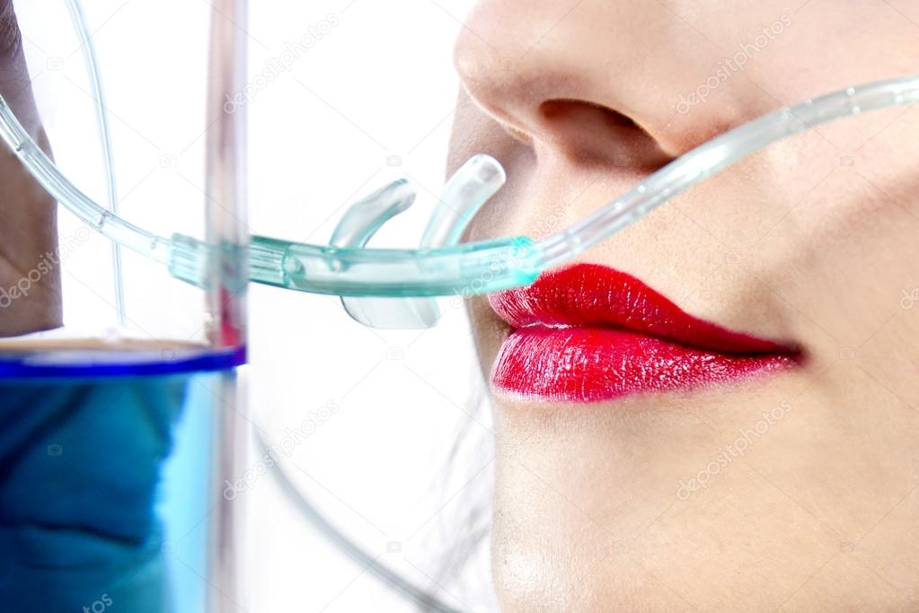 Woman inhaling flavored oxygen