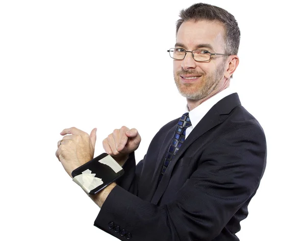 Businessman tapes a cellphone as a DIY smartwatch — Stock Photo, Image