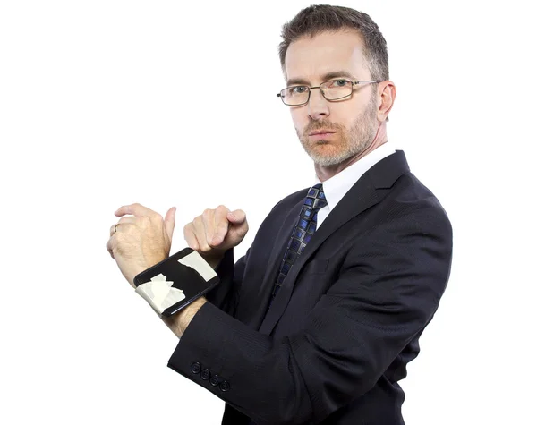 Businessman tapes a cellphone as a DIY smartwatch — Stock Photo, Image