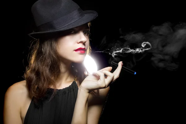 Female vaping an electronic cigarette — Stock Photo, Image