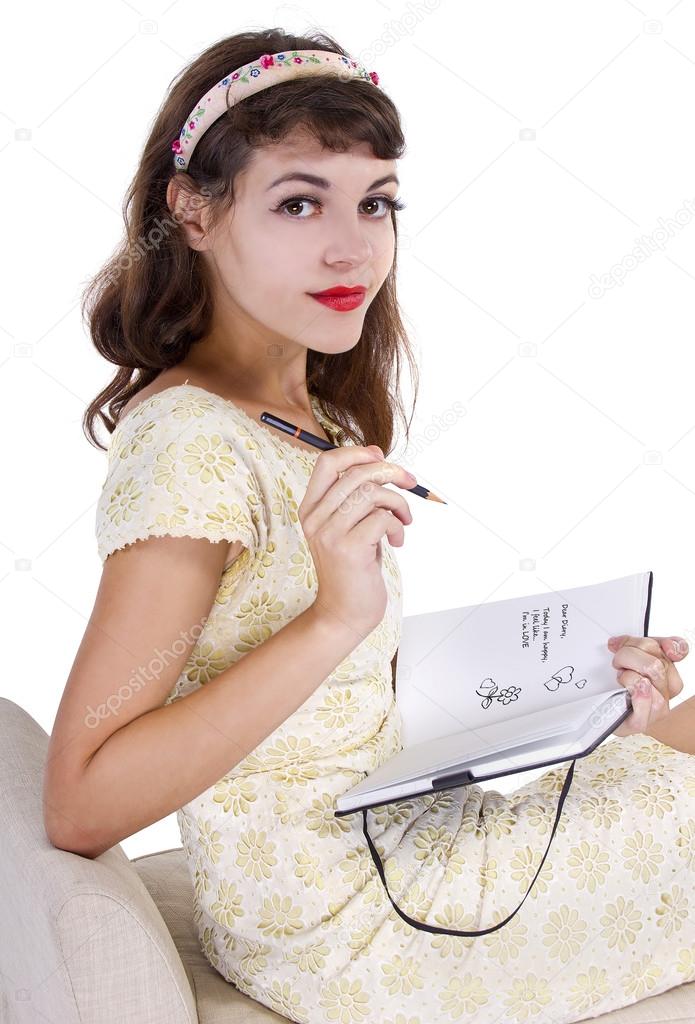 female writing on  diary