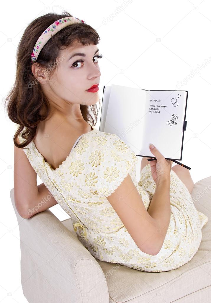 female writing on  diary