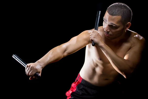 Man demonstrating stick fighting — Stock Photo, Image