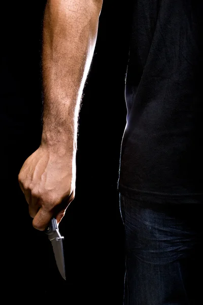 Robbers hands holding knife — Stock Photo, Image