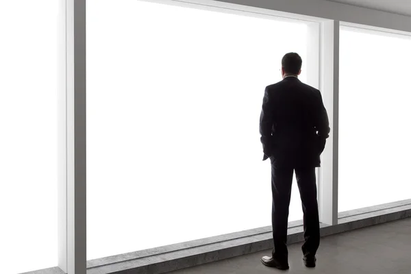 Businessman looking out window — Stock Photo, Image