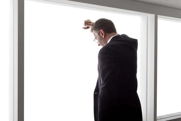 Businessman looking out window — Stock Photo, Image