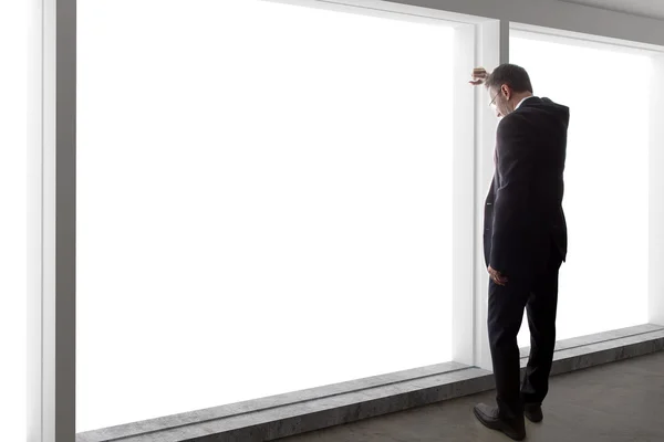 Businessman looking out window — Stock Photo, Image