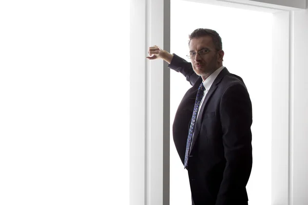 Businessman looking out window — Stock Photo, Image