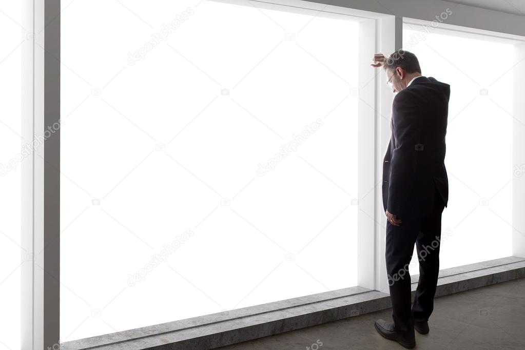 businessman looking out window