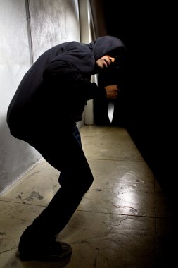 criminal with a knife hiding