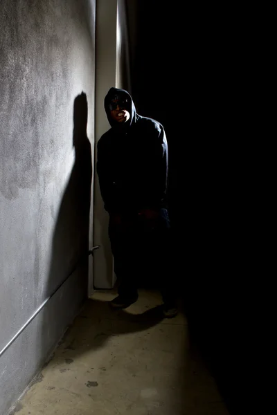 Hooded criminal stalking — Stock Photo, Image