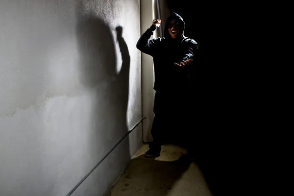 Hooded criminal stalking — Stock Photo, Image