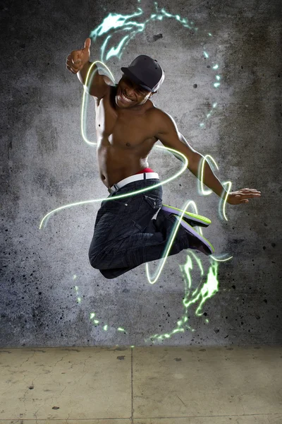 Jumping man stylized with lights — Stock Photo, Image