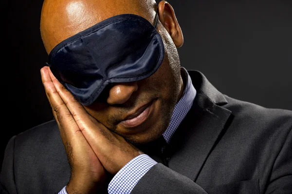 Affärsman bära eye mask — Stockfoto