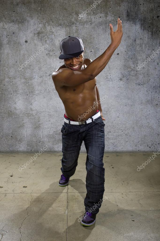 Man wearing hip hop clothing Stock Photo by innovatedcaptures