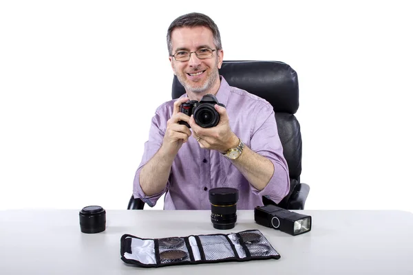Professional photographer showing camera gear — Stock Photo, Image