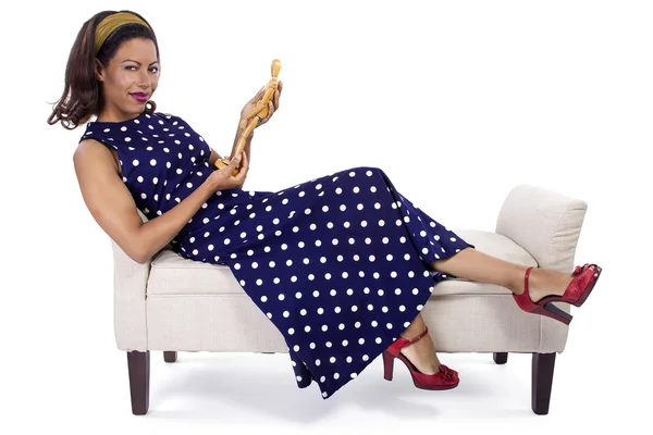 Woman holding wooden figurine — Stock Photo, Image