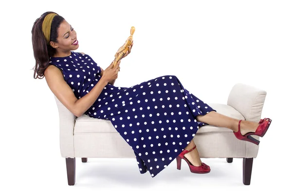 Woman holding wooden figurine — Stock Photo, Image