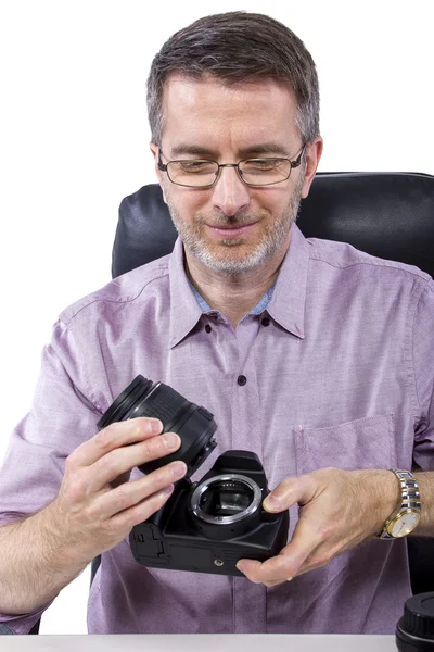 Professional photographer showing camera gear — Stock Photo, Image