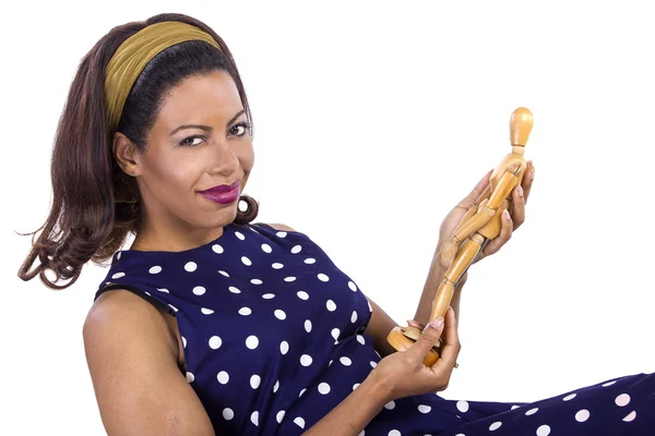 Woman holding wooden figurine — Stock Photo, Image