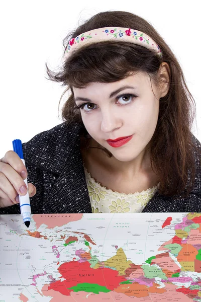 Female holding pen and writing on map — Stock Photo, Image