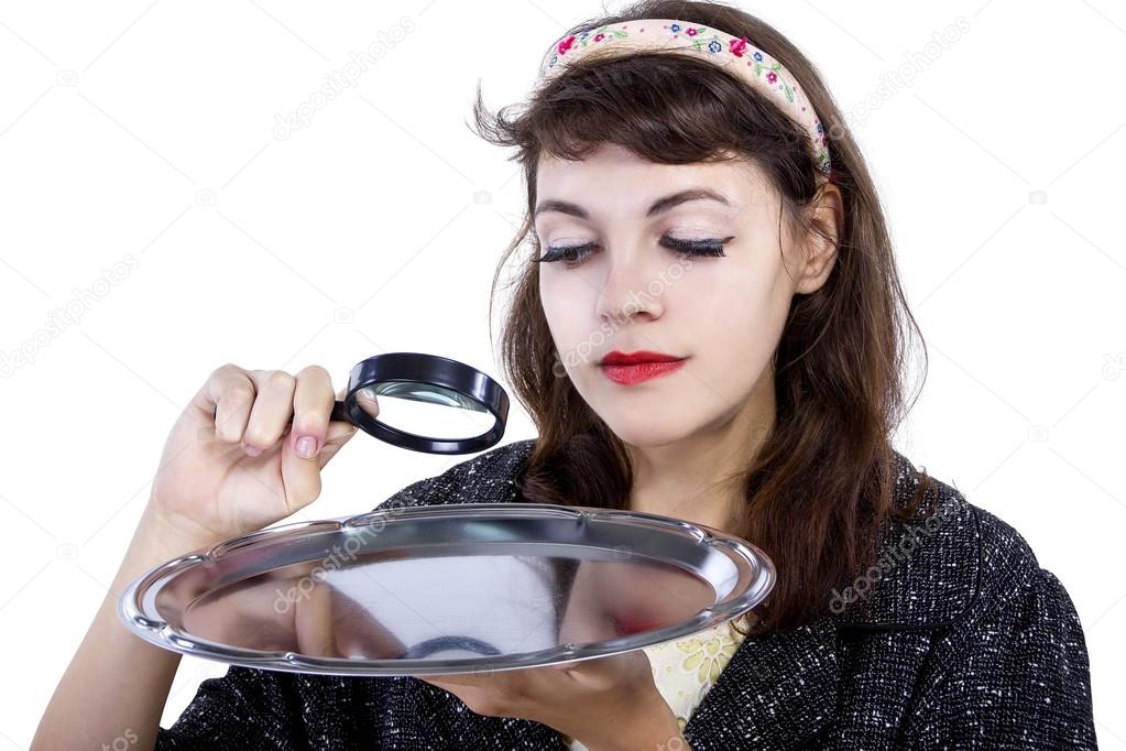 woman looking with magnifying glass