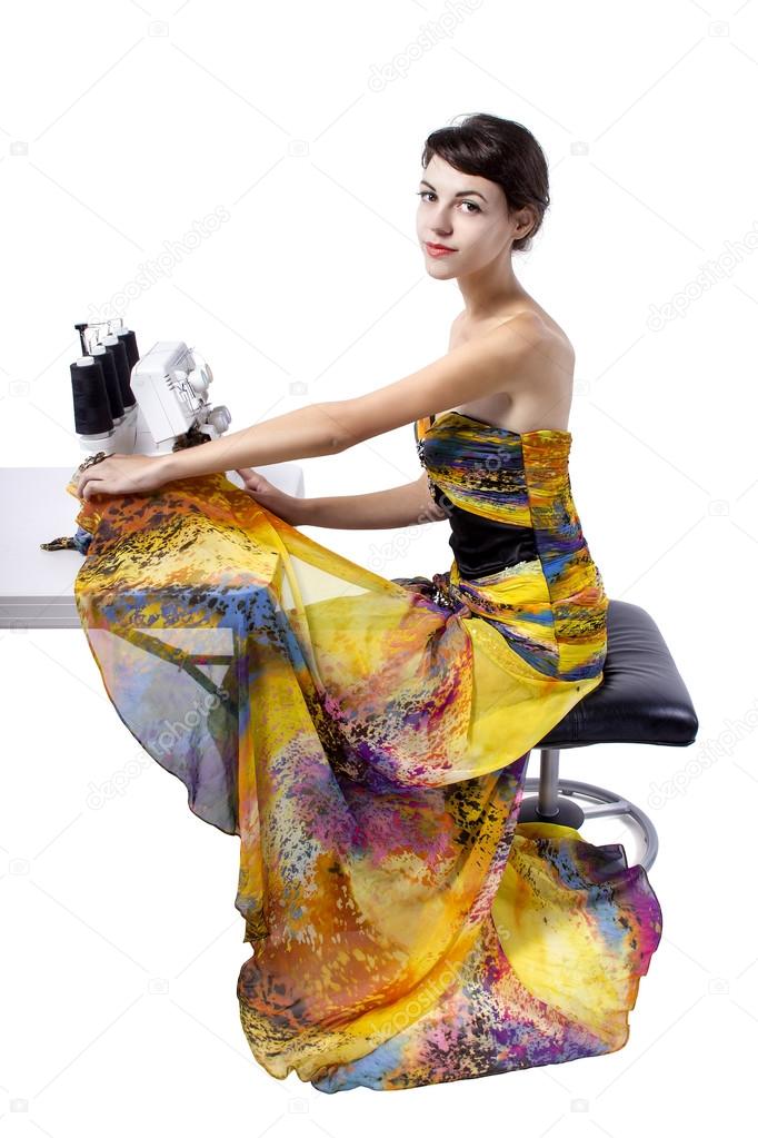 Woman stitching with sewing machine