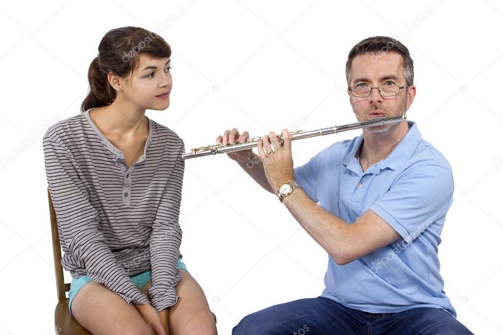 Music instructor teaching play flute