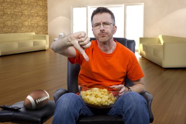 man watching football on television clipart