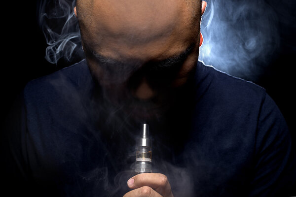 Man smoking electronic cigarette
