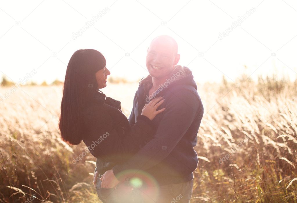 Young and beautiful couple love walking outdoors in autumn families