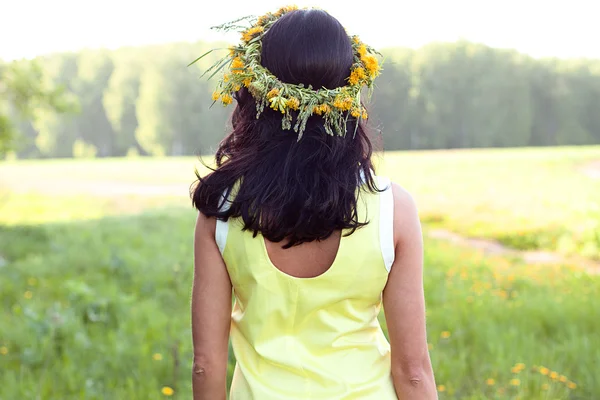 Beautiful brunette woman fashion style outdoors in yellow dress smiling happy concept idea to look into the distance — Stock Photo, Image