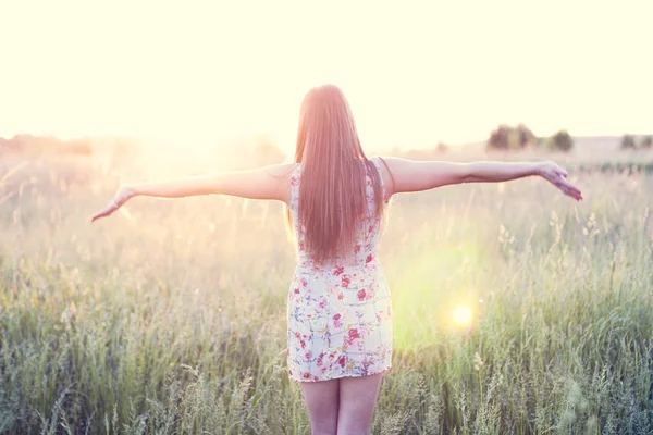 Beautiful girl field green meadow in summer park delicate dress, enjoying leisure, fashion style, glamor life,  student at a bright sunny day. — Stock Photo, Image