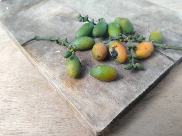 Gnetum Gnemon Fruit Resting Wooden Chopping Board — Stock Photo, Image