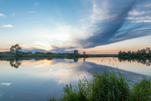 Enjoying sunset in a forest near the little river in Agidel town, Bashkortostan republic of Russia