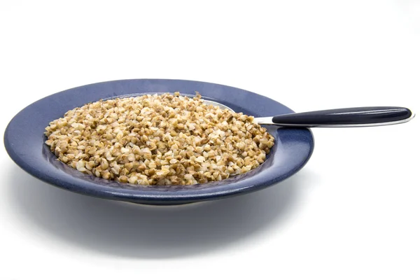 Buckwheat porridge in plate — Stock Photo, Image