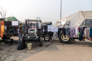 farmers drying their clothes at protest site at singhu border,they are protesting against the farmer law in india. clipart