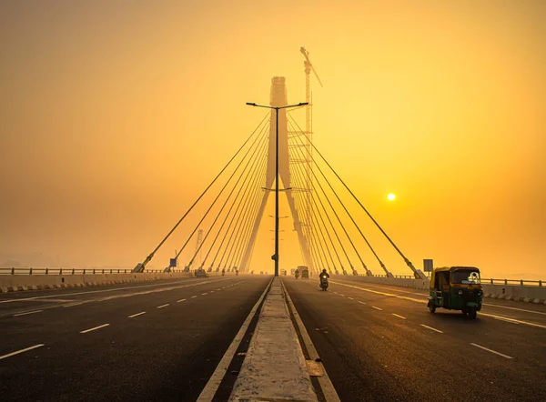 signature bridge is a cantilever spar cable stayed bridge which spans the yamuna river in delhi,with beautiful sun rise.