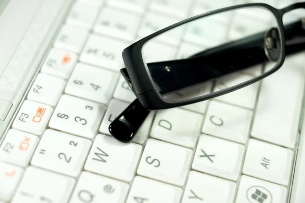 A glasses and computer — Stock Photo, Image