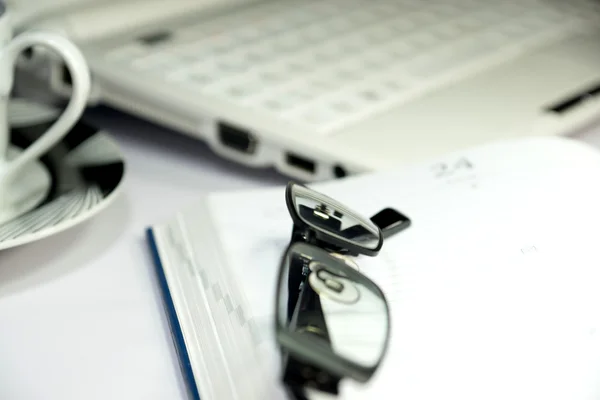 A diary and glasses Stock Image