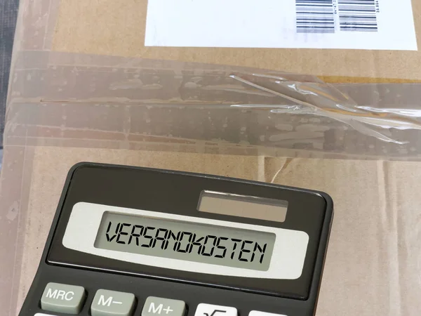 Package Calculator Shipping Costs — Stock Photo, Image