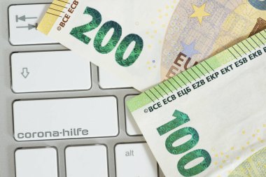 Bilgisayar, avro banknotları ve Corona virüsü salgını yüzünden yardım