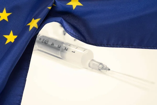 Flag of the European Union EU and vaccination against Corona Virus