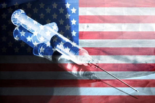 Flag of USA, syringe and vaccination against corona virus