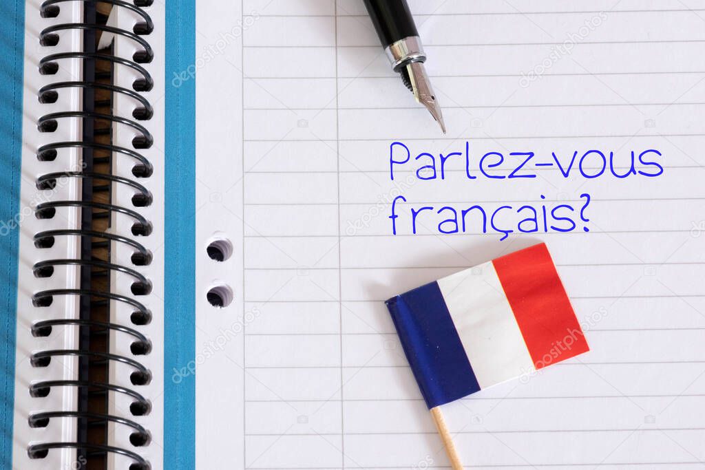 Flag of France, exercise book and question Do you speak French