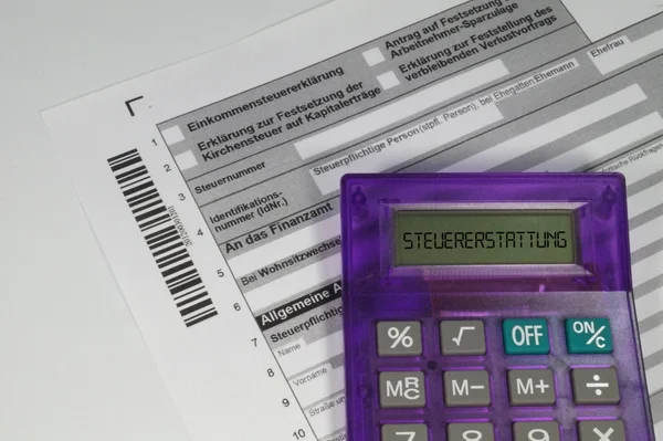 Calculator and tax return form — Stock Photo, Image