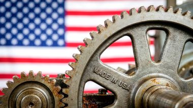 Amerikan yapımı ürünlerin kalitesinin sembolü olarak Amerika 'da üretilen bir makine ve çarklar..