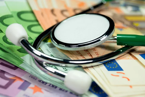close-up shot of euro cash banknotes and stethoscope for background